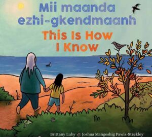 The cover of Mii Maanda Ezhi-Gkendmaanh has an adult and child walking on the beach